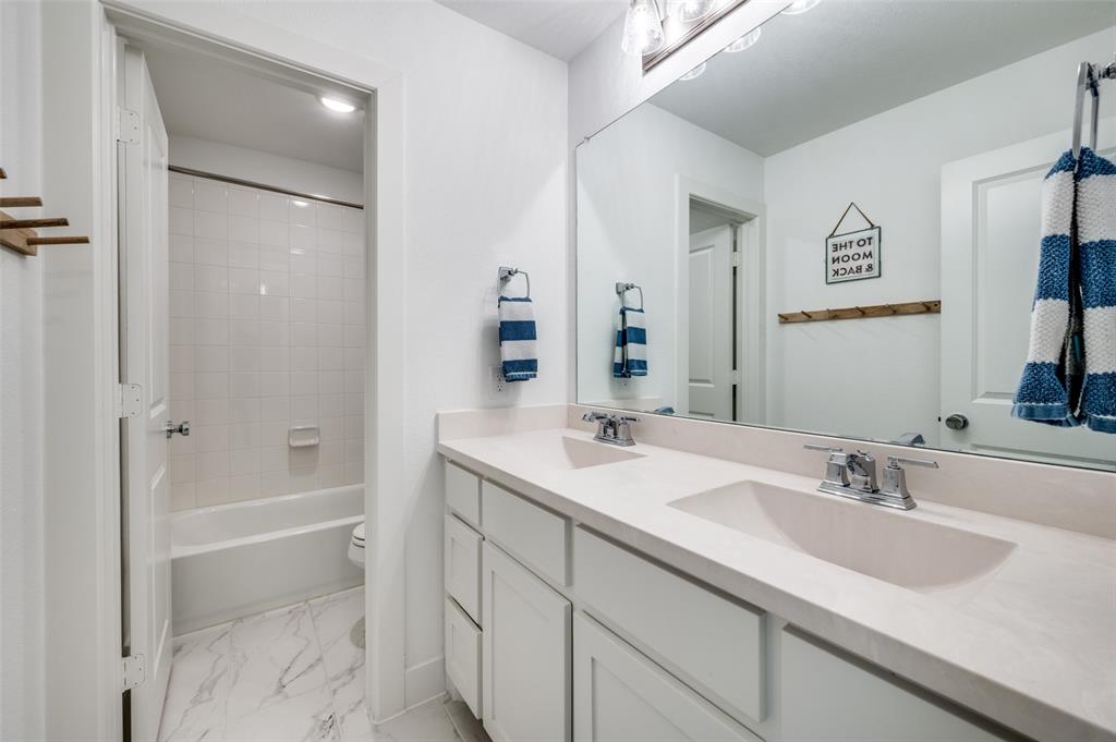 440 Sounding Street Aubrey, TX 76227 - Photo 28 of 40 a bathroom with a sink tub vanity and shower
