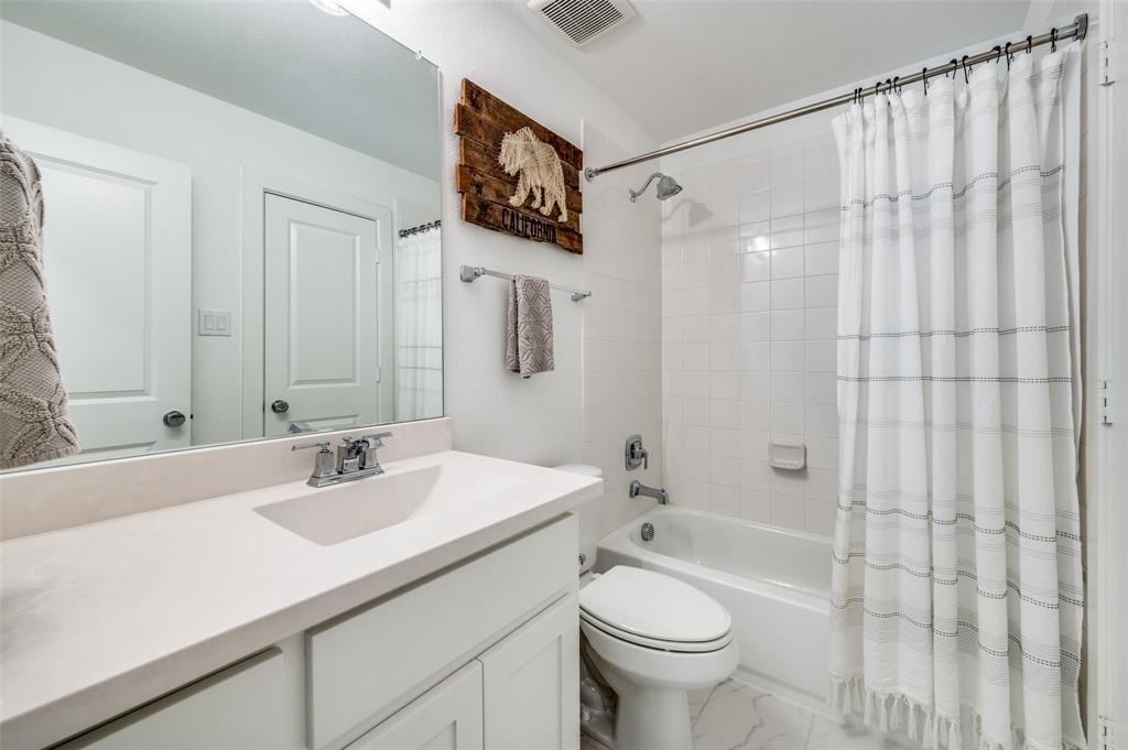 440 Sounding Street Aubrey, TX 76227 - Photo 31 of 40 a bathroom with a sink a toilet and shower