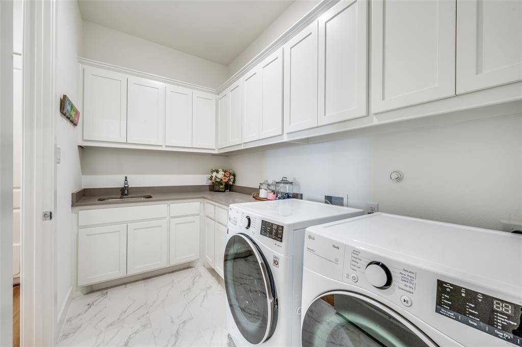 440 Sounding Street Aubrey, TX 76227 - Photo 32 of 40 a utility room with dryer and washer
