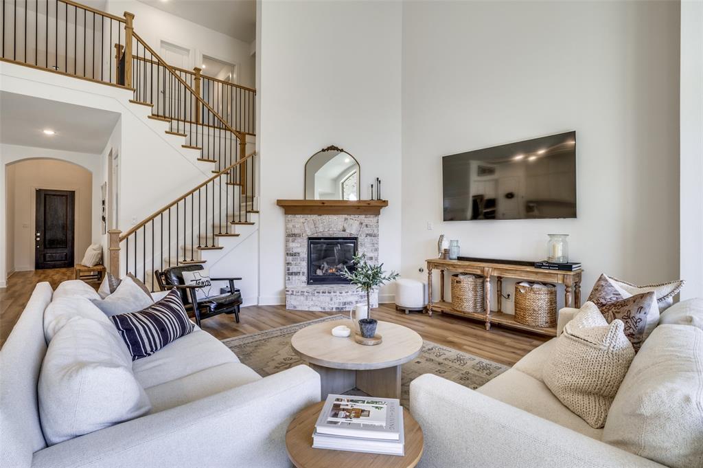 440 Sounding Street Aubrey, TX 76227 - Photo 4 of 40 a living room with furniture and a flat screen tv
