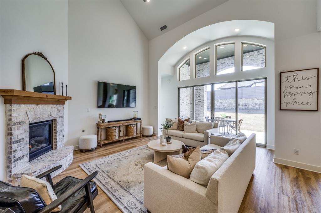 440 Sounding Street Aubrey, TX 76227 - Photo 5 of 40 a living room with furniture fireplace and flat screen tv
