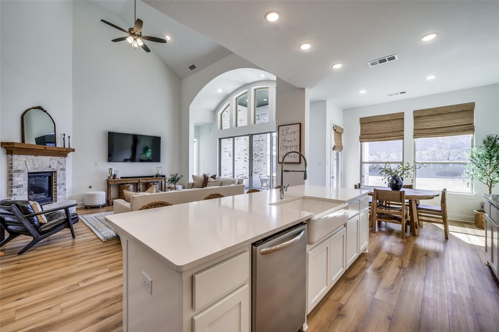 440 Sounding Street Aubrey, TX 76227 - Photo 10 of 40 an open kitchen with sink and breakfast area