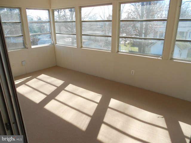 406 Crisfield Road Baltimore, MD 21220 - Photo 22 of 30 Freshly Painted and Carpeted Sunroom