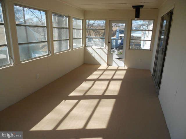 406 Crisfield Road Baltimore, MD 21220 - Photo 23 of 30 Freshly Painted and Carpeted Sunroom