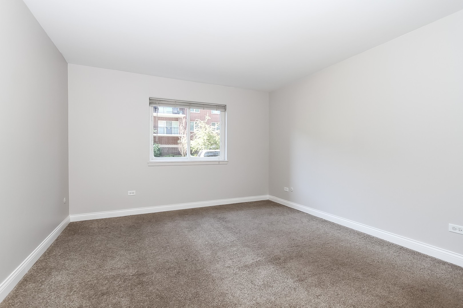 1650 Mill Street, Unit 103 Des Plaines, IL 60016 - Photo 13 of 19 an empty room with a window