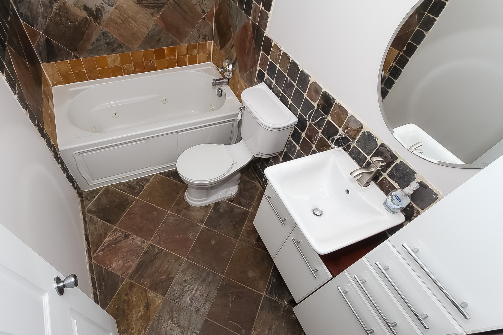 1650 Mill Street, Unit 103 Des Plaines, IL 60016 - Photo 15 of 19 a bathroom with a sink a toilet and bathtub