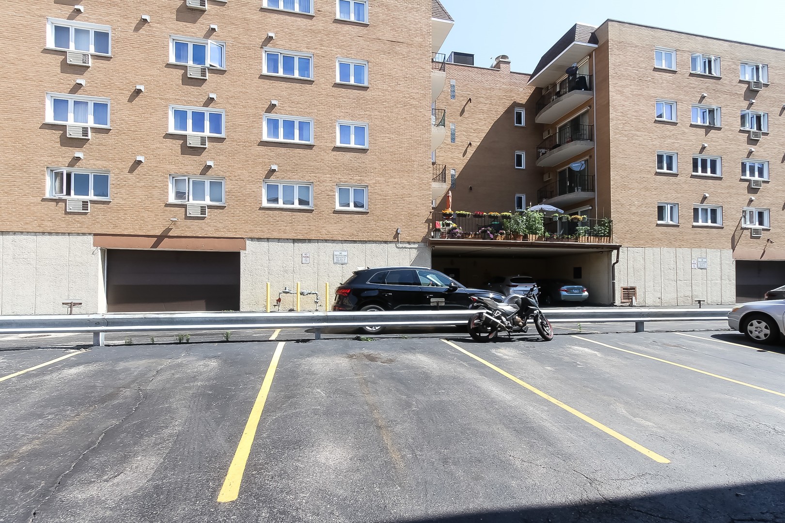 1650 Mill Street, Unit 103 Des Plaines, IL 60016 - Photo 19 of 19 a car parked in front of a building