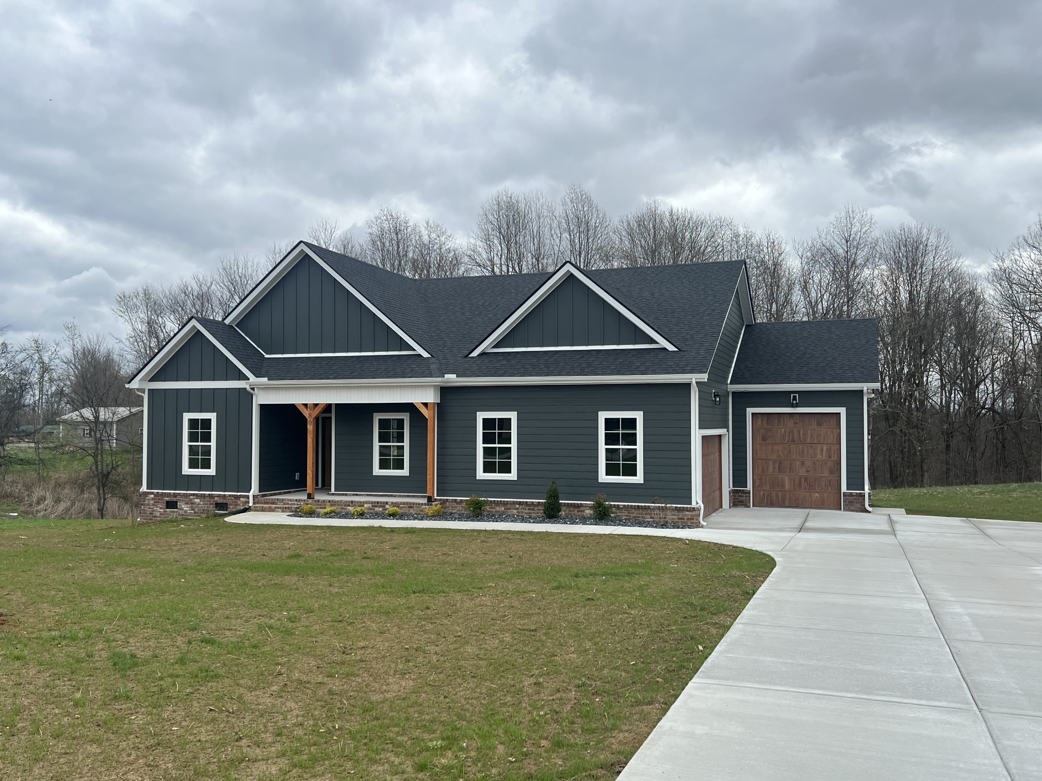 980 Hurricane Ridge Road Smithville, TN 37166 - Photo 2 of 5 a front view of a house with yard