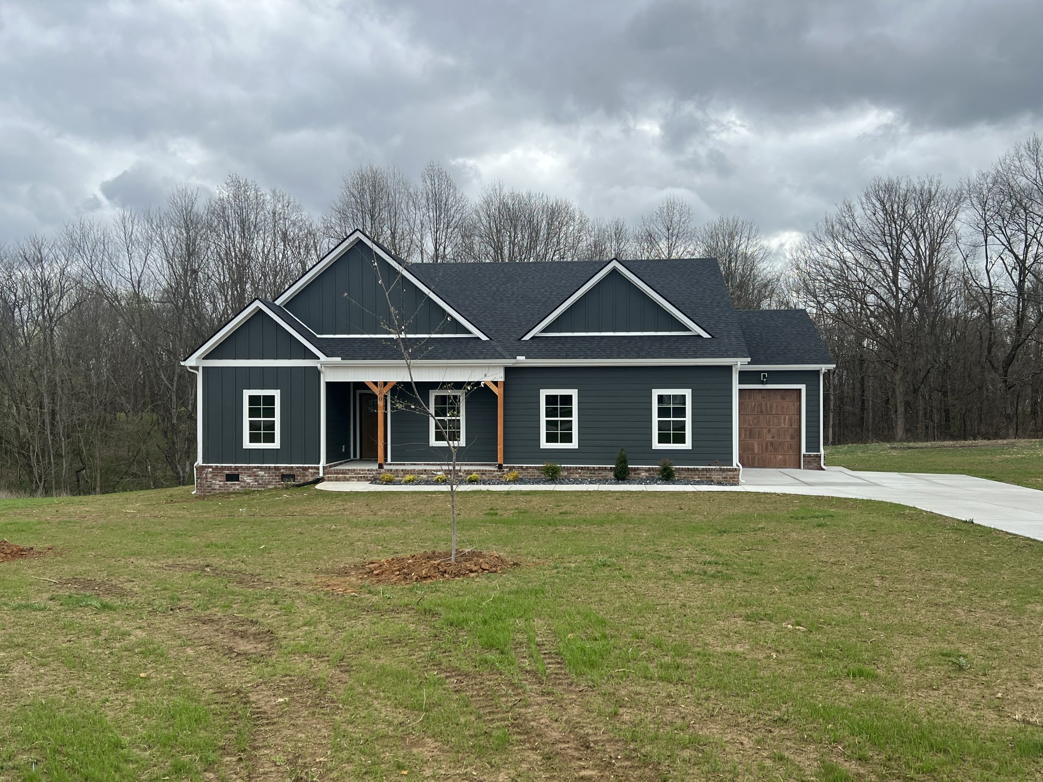 980 Hurricane Ridge Road Smithville, TN 37166 - Photo 3 of 5 a front view of a house with a yard