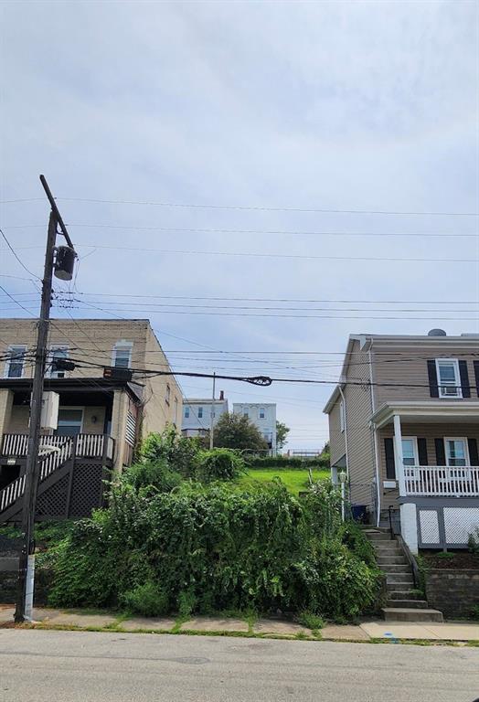 a view of a house with a street