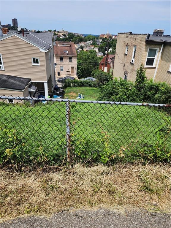 311 Natchez Street Pittsburgh, PA 15211 - Photo 16 of 17 an aerial view of a house with a yard and lake