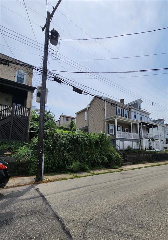 311 Natchez Street Pittsburgh, PA 15211 - Photo 6 of 17 a front view of a house with a yard