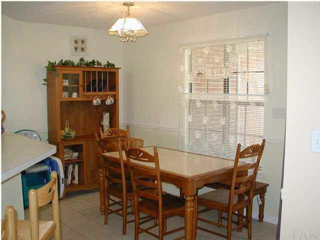 2401 Crescent Road Navarre, FL 32566 - Photo 4 of 9 Breakfast nook with window that overlooks the large back yard.