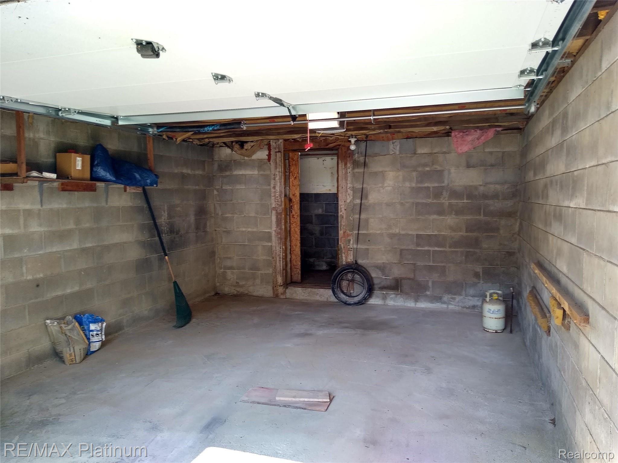 1555 Chilson Road Howell, MI 48843 - Photo 39 of 47 Garage with cold storage room in back