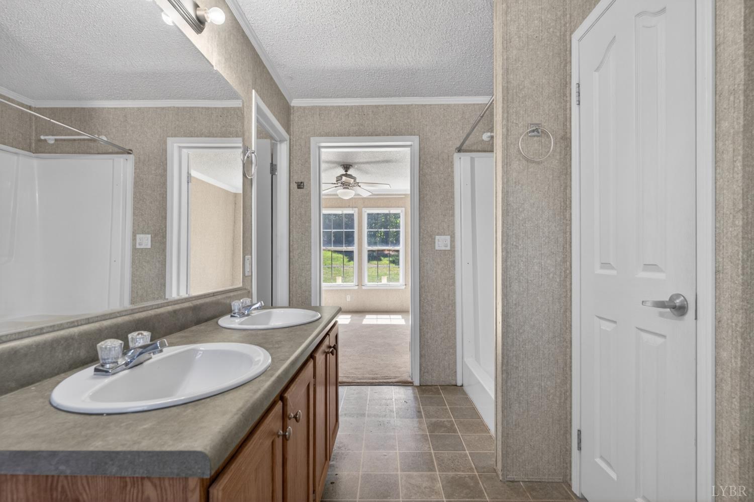 1811 Mohawk Road Gladys, VA 24554 - Photo 12 of 51 a bathroom with a sink double vanity and a mirror