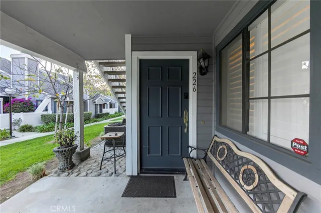 a view of a door and chair in the garden