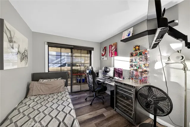 a bedroom with furniture and a window