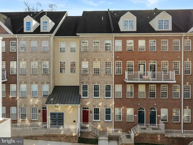 a front view of a building with glass windows