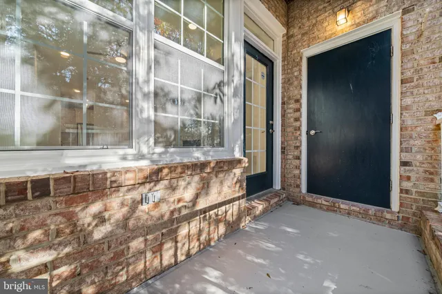 a view of entryway with brick walls