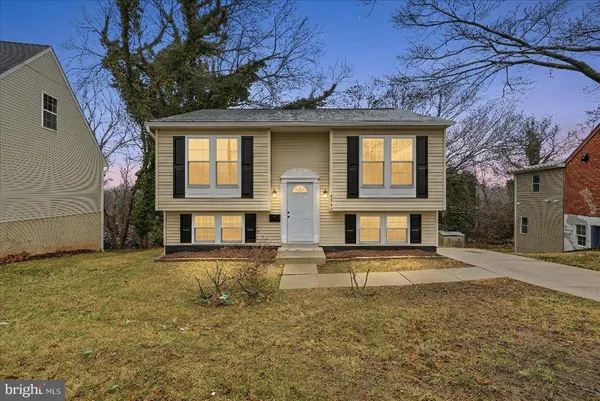 front view of a house with a yard