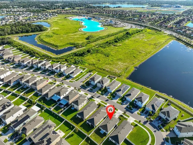 view of a pool a yard with lawn chairs