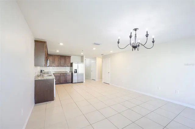 a view of a kitchen with a sink and cabinets