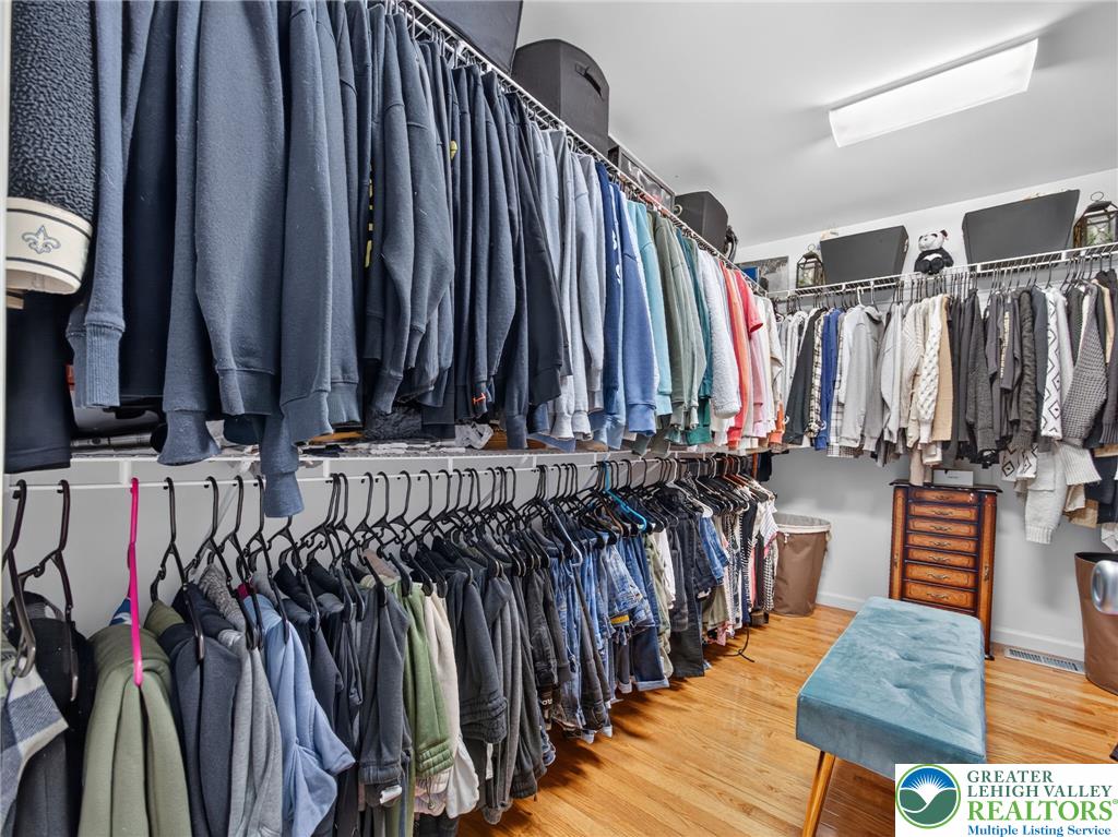 4148 Ross Road Bethlehem, PA 18020 - Photo 57 of 67 Custom shelving and ample hanging space create an organized and spacious walk-in closet.