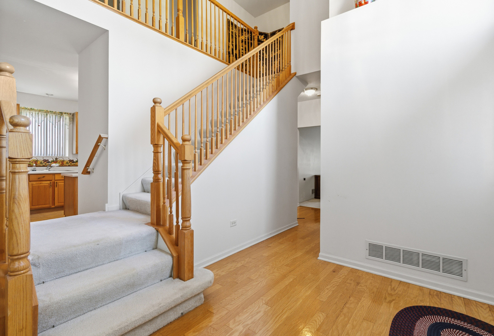 100 Sycamore Drive Bolingbrook, IL 60490 - Photo 14 of 42 a view of entryway and hall with wooden floor