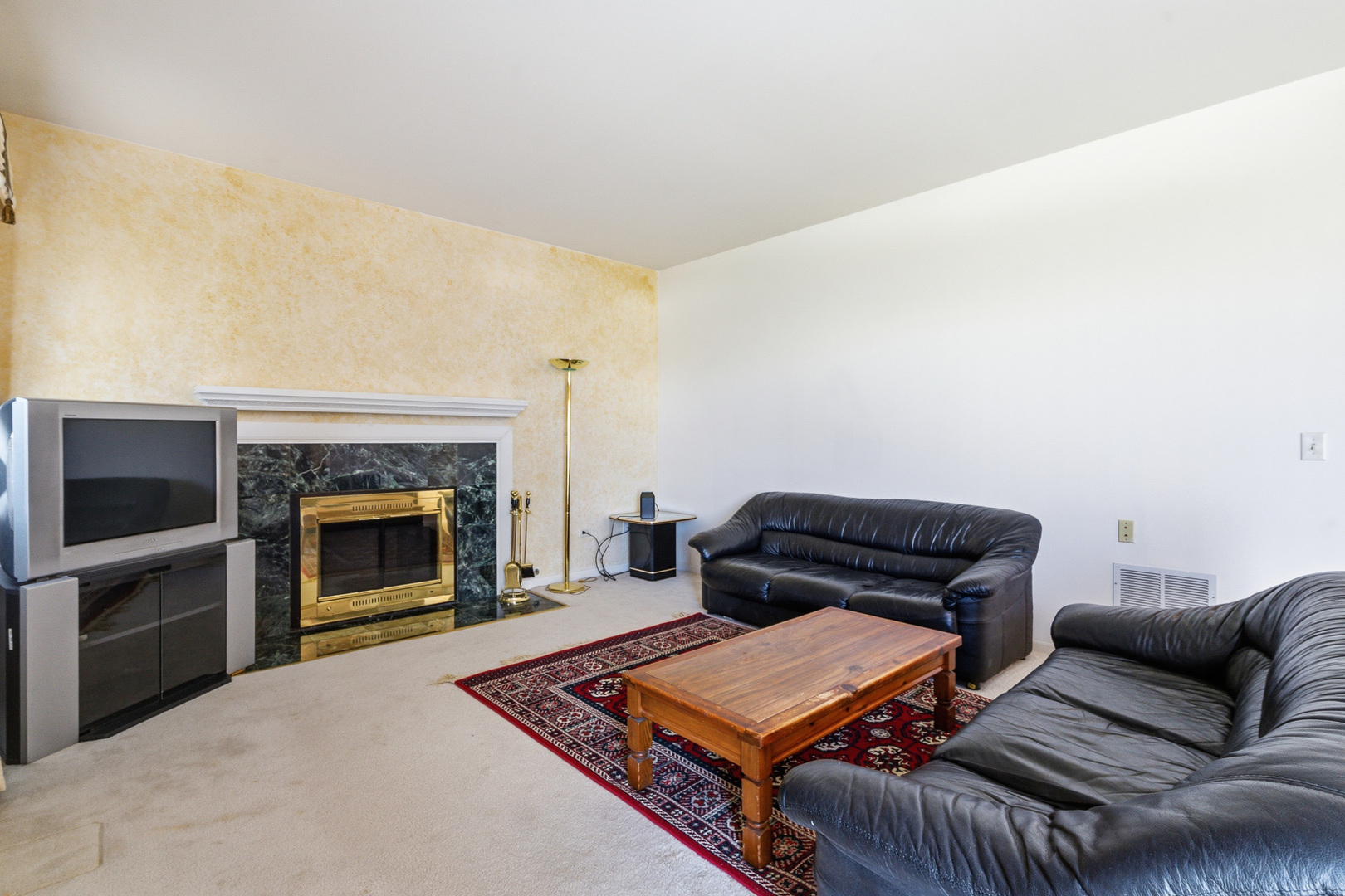 100 Sycamore Drive Bolingbrook, IL 60490 - Photo 15 of 42 a living room with furniture and a fireplace