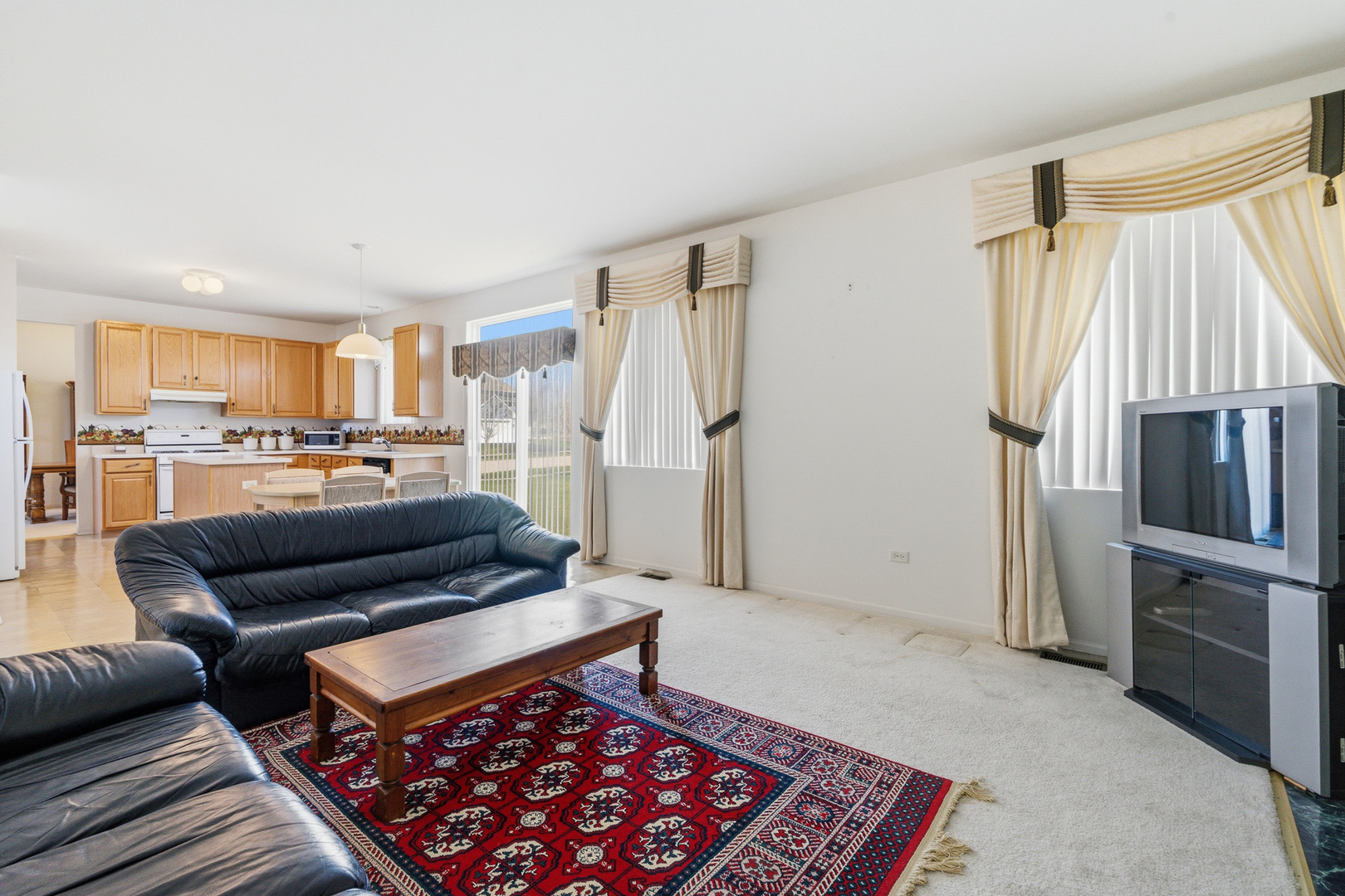 100 Sycamore Drive Bolingbrook, IL 60490 - Photo 17 of 42 a living room with furniture and a rug