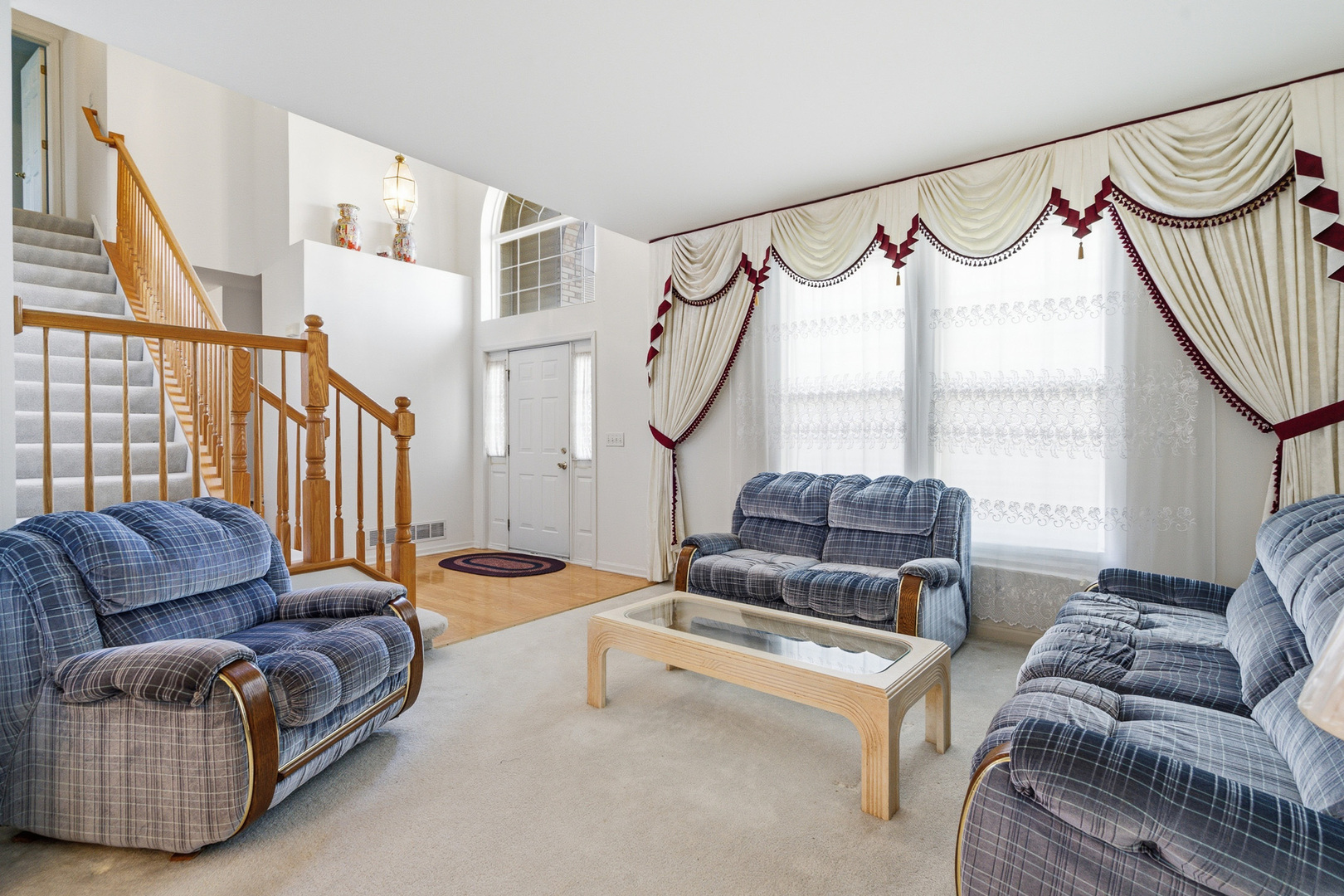 100 Sycamore Drive Bolingbrook, IL 60490 - Photo 3 of 42 a living room with furniture a flat screen tv and a window