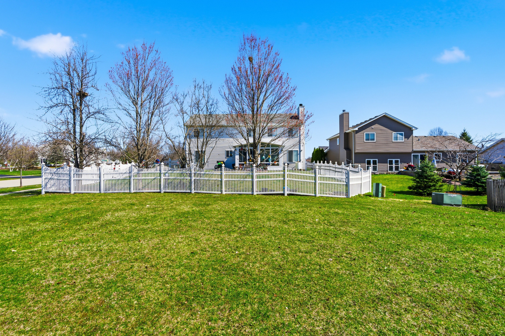 100 Sycamore Drive Bolingbrook, IL 60490 - Photo 38 of 42 a view of a house with a big yard and large trees