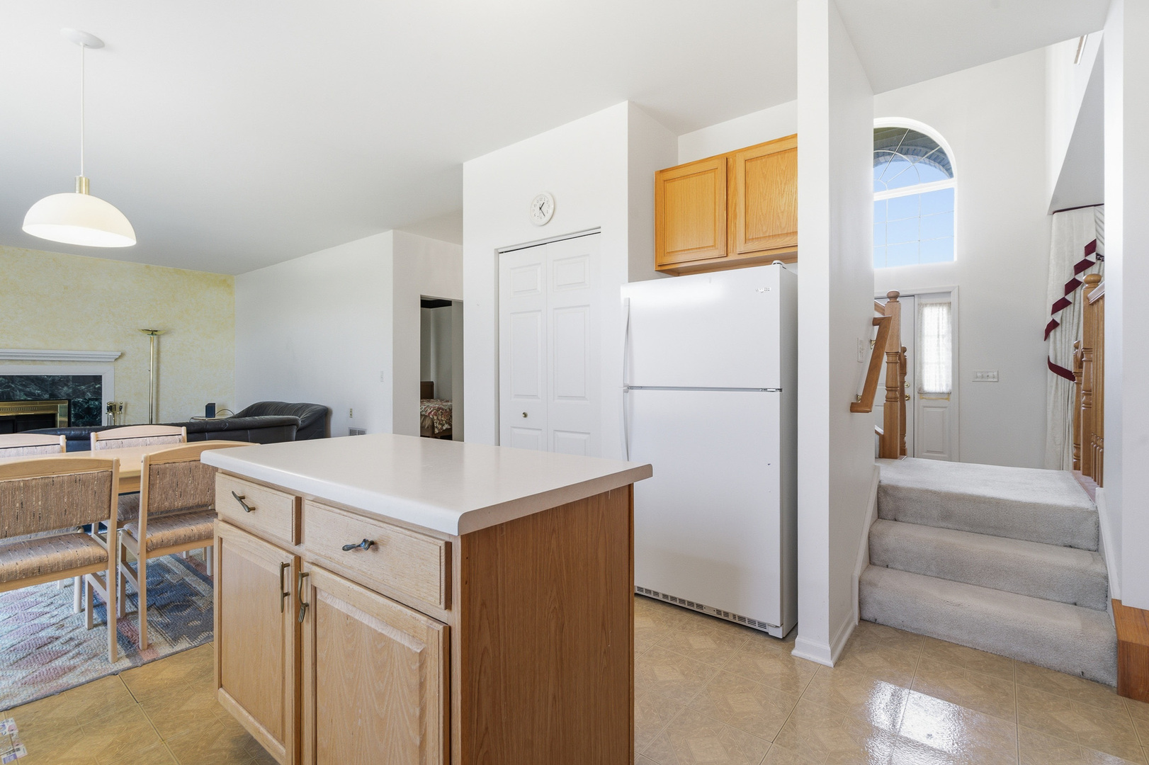 100 Sycamore Drive Bolingbrook, IL 60490 - Photo 9 of 42 a kitchen with a sink a refrigerator a stove and white cabinets