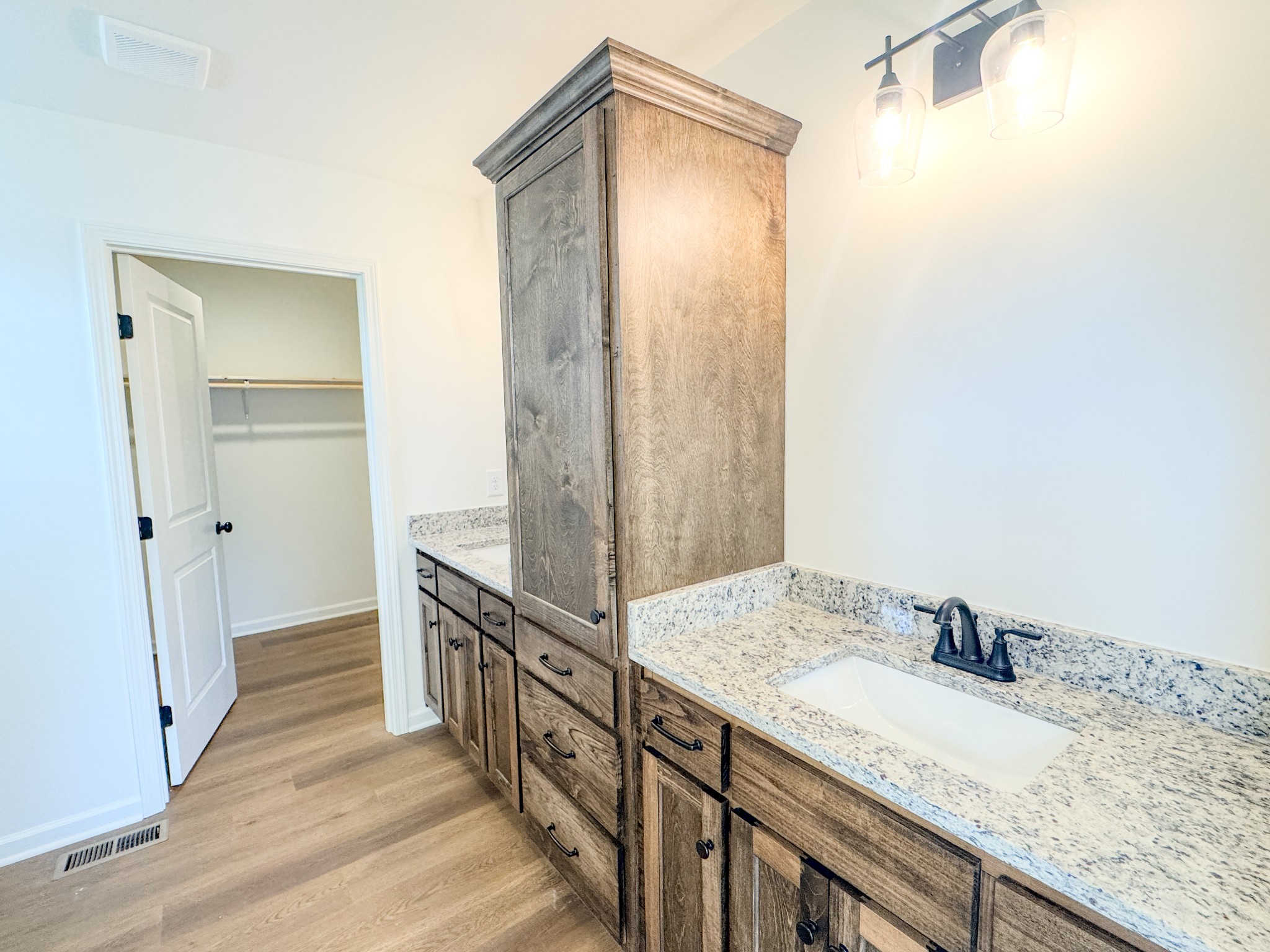 575 Pleasant Hill Road Lafayette, TN 37083 - Photo 17 of 51 a bathroom with a granite countertop sink and a mirror