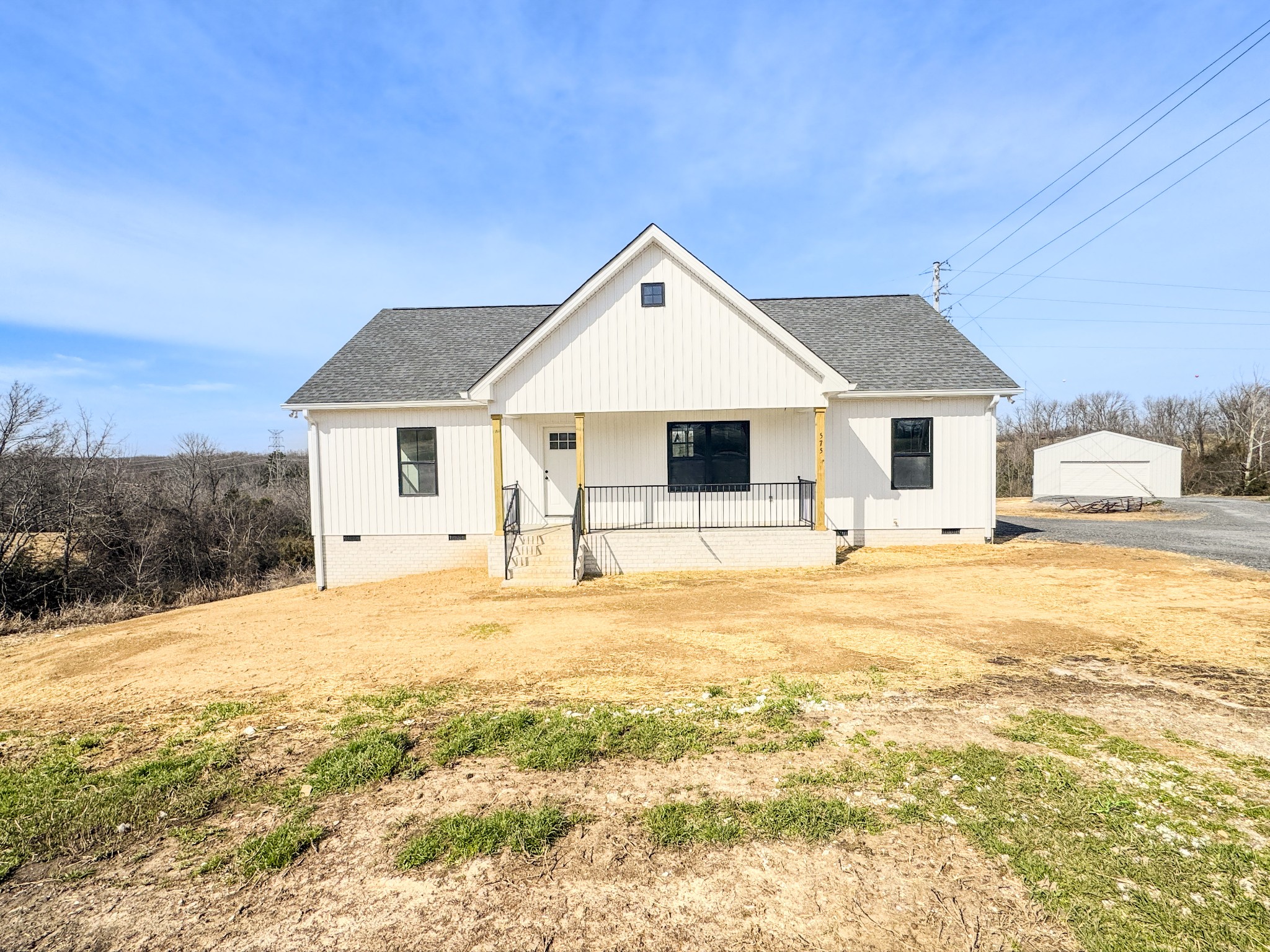 575 Pleasant Hill Road Lafayette, TN 37083 - Photo 34 of 51 a front view of a house with a yard