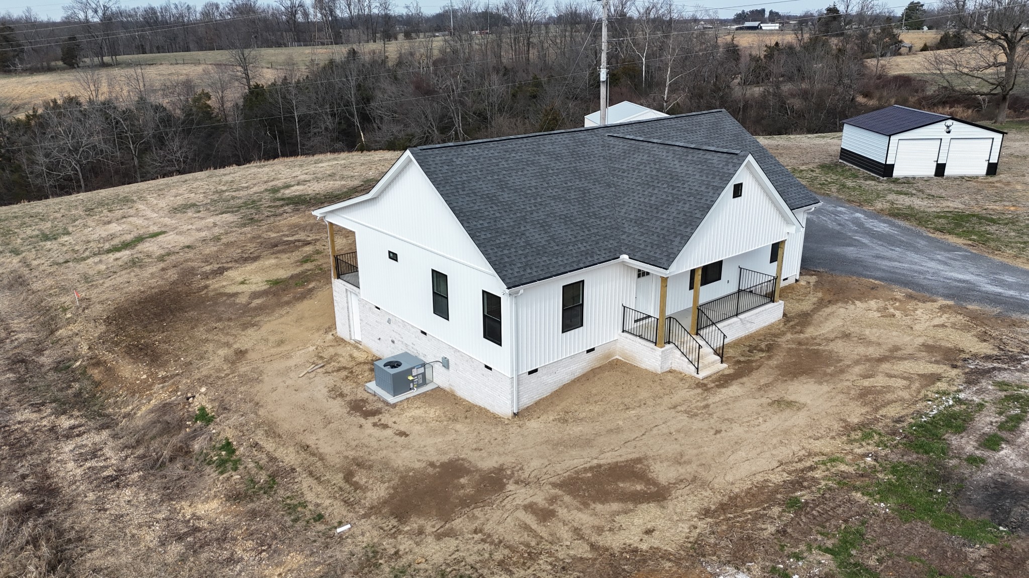 575 Pleasant Hill Road Lafayette, TN 37083 - Photo 37 of 51 a aerial view of a house with a yard