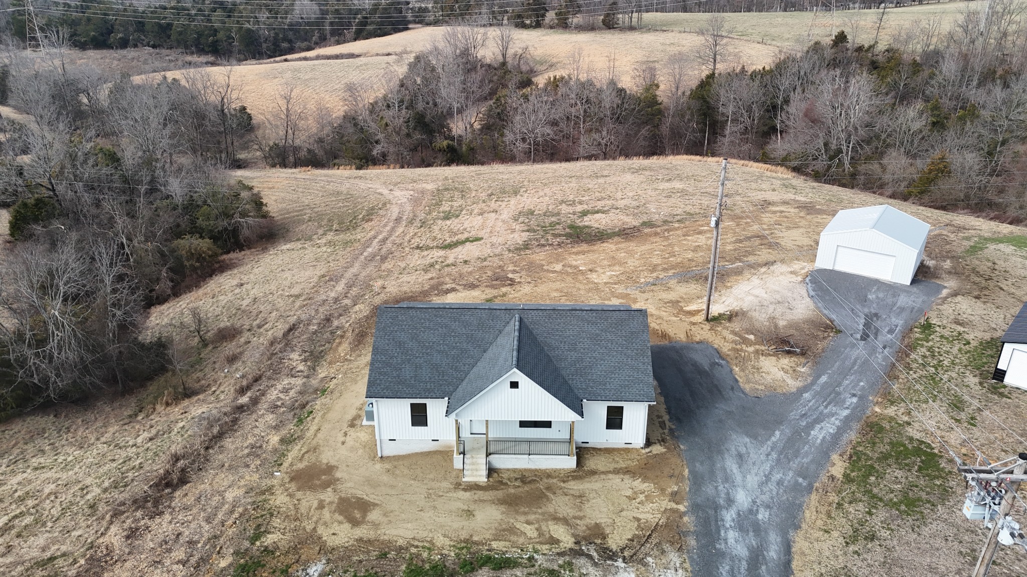 575 Pleasant Hill Road Lafayette, TN 37083 - Photo 38 of 51 a view of wooden house and a yard