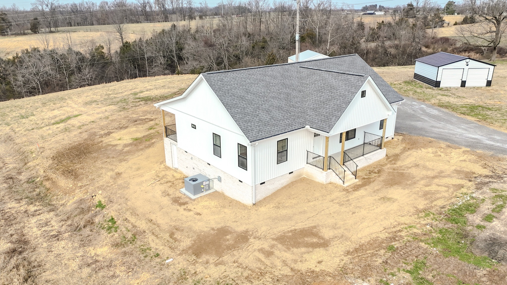 575 Pleasant Hill Road Lafayette, TN 37083 - Photo 4 of 51 a view of a house with a yard and covered with snow