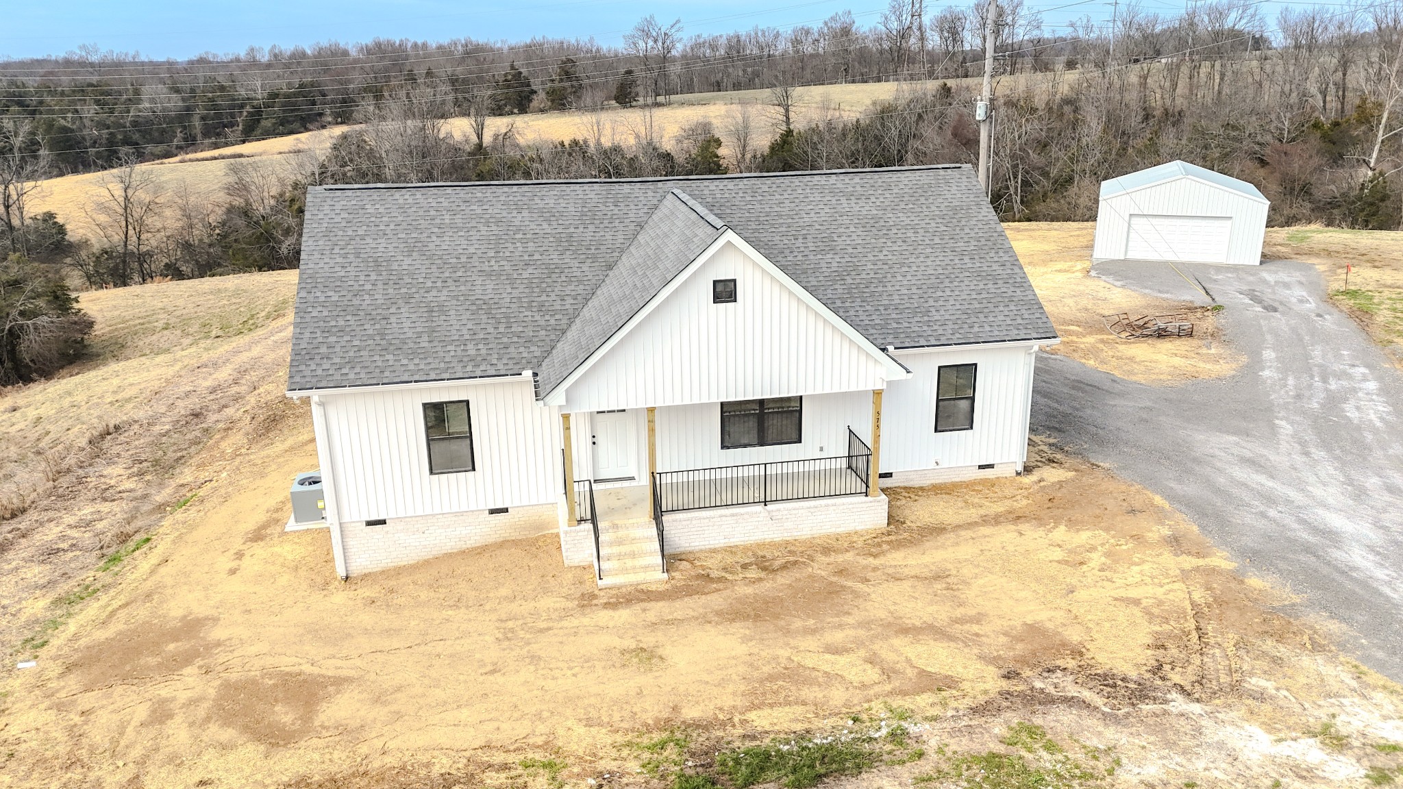 575 Pleasant Hill Road Lafayette, TN 37083 - Photo 5 of 51 a front view of a house with a yard