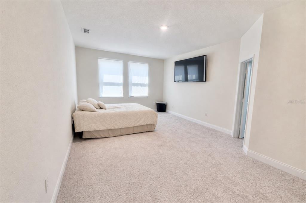 975 Vineyard Rdg Road Minneola, FL 34715 - Photo 12 of 19 a bedroom with a bed and a window