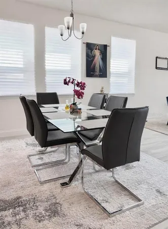 a view of a dining room with furniture