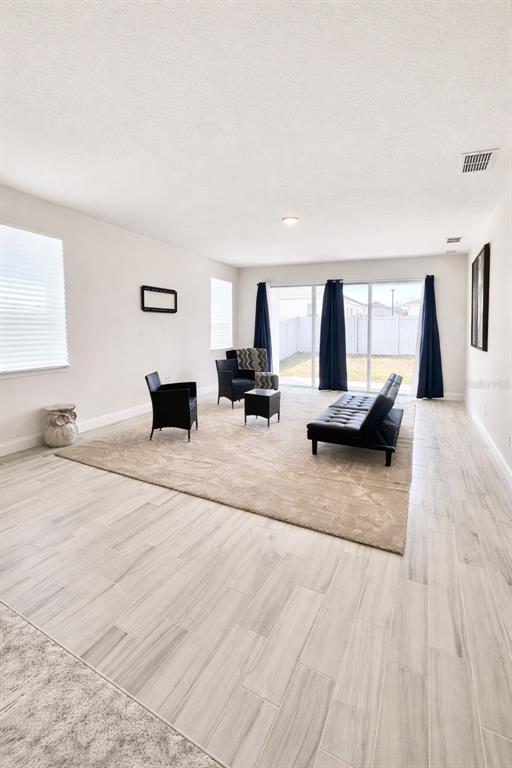 975 Vineyard Rdg Road Minneola, FL 34715 - Photo 9 of 19 a living room with furniture window and a table