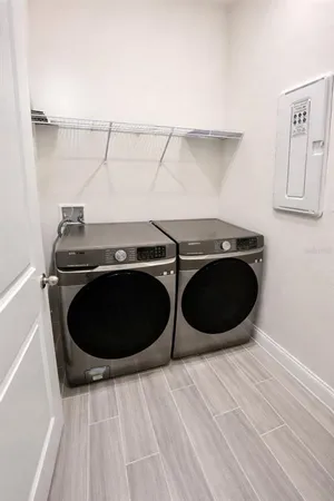 a stove top oven sitting inside of a kitchen