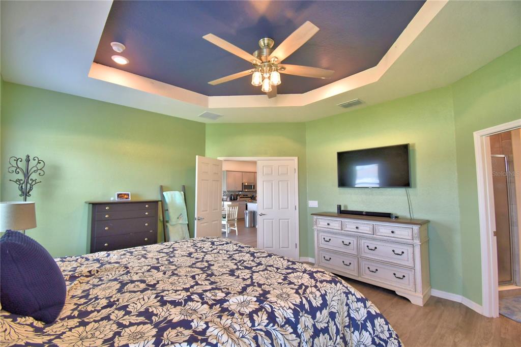 4340 Reding Way Lakeland, FL 33813 - Photo 43 of 63 a bedroom with a bed and a dresser in it