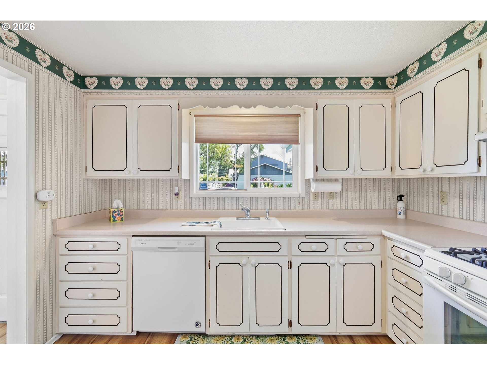 2494 38th Street Springfield, OR 97477 - Photo 11 of 38 a kitchen with stainless steel appliances a sink and cabinets