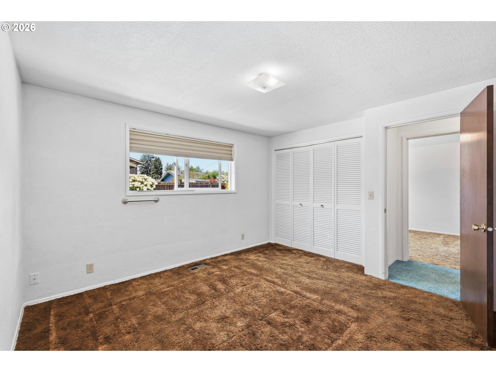 2494 38th Street Springfield, OR 97477 - Photo 19 of 38 a view of an empty room with wooden floor
