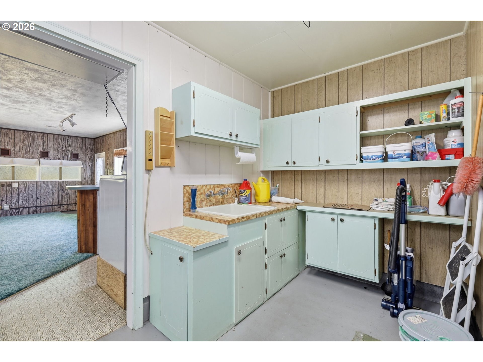 2494 38th Street Springfield, OR 97477 - Photo 26 of 38 a kitchen with a sink a stove and cabinets