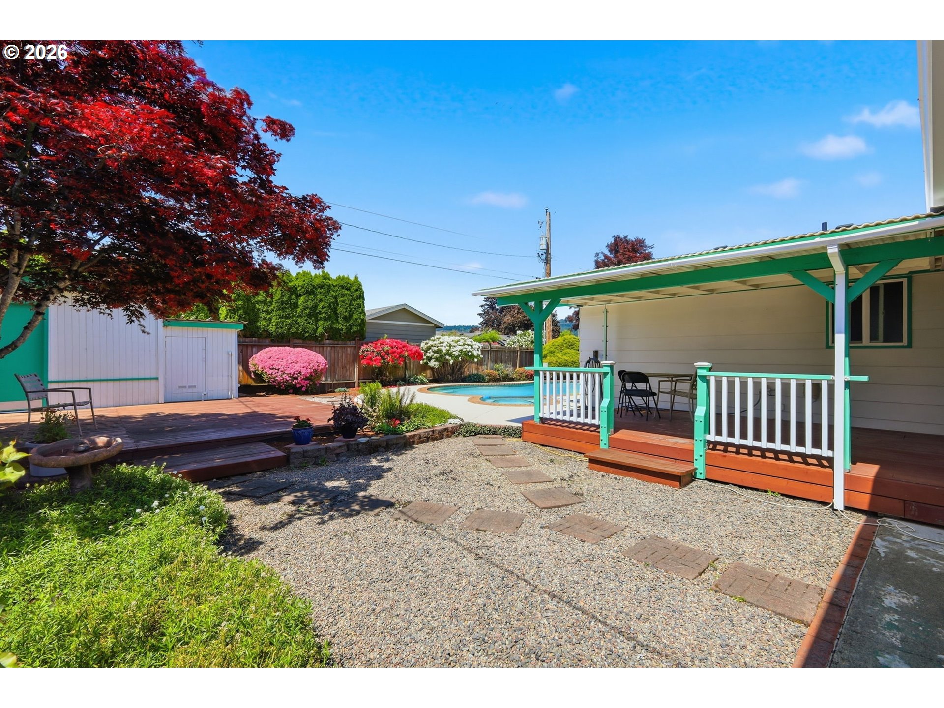 2494 38th Street Springfield, OR 97477 - Photo 30 of 38 a backyard of a house with table and chairs a barbeque