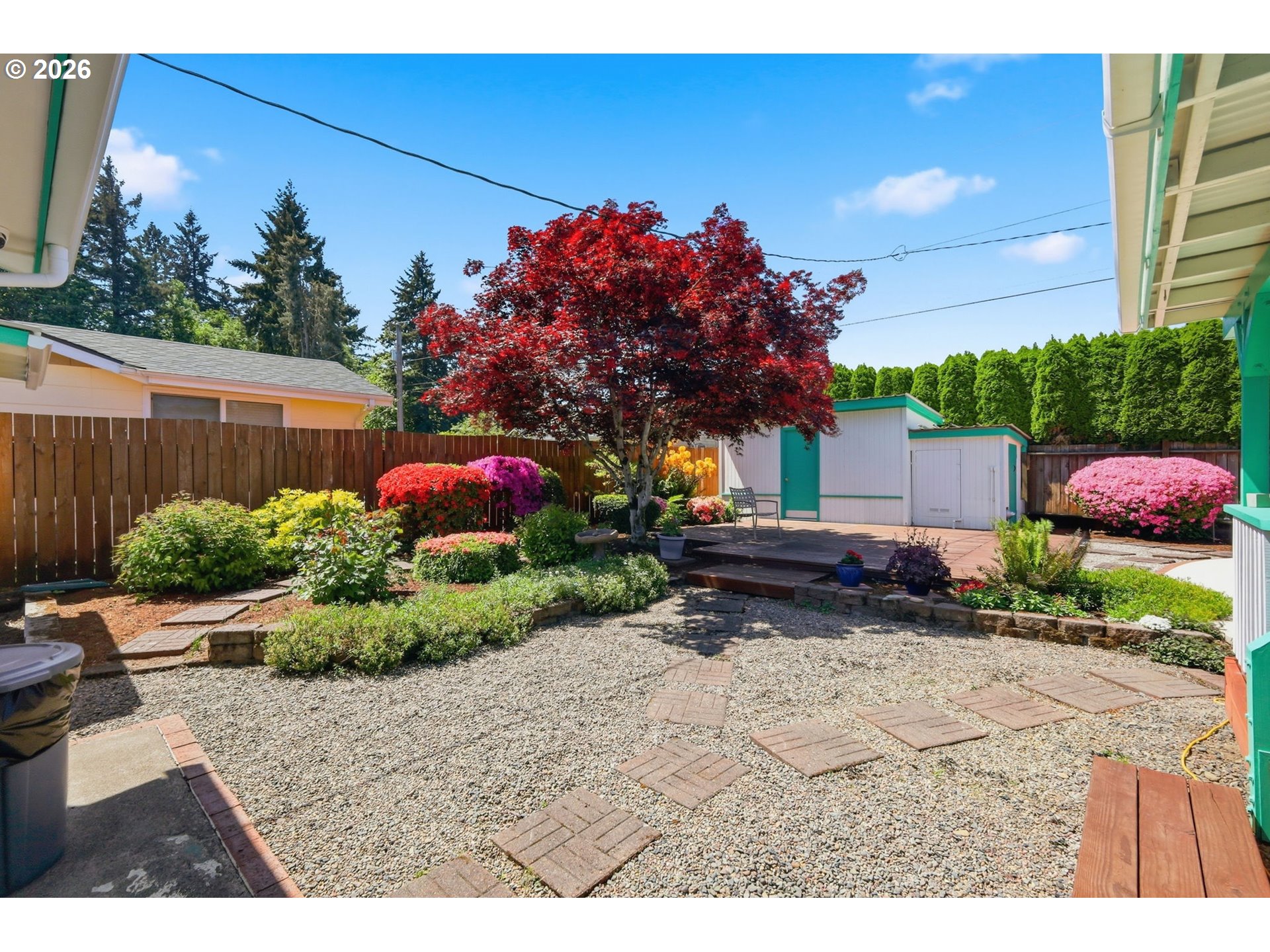 2494 38th Street Springfield, OR 97477 - Photo 31 of 38 a backyard of a house with a garden and outdoor seating