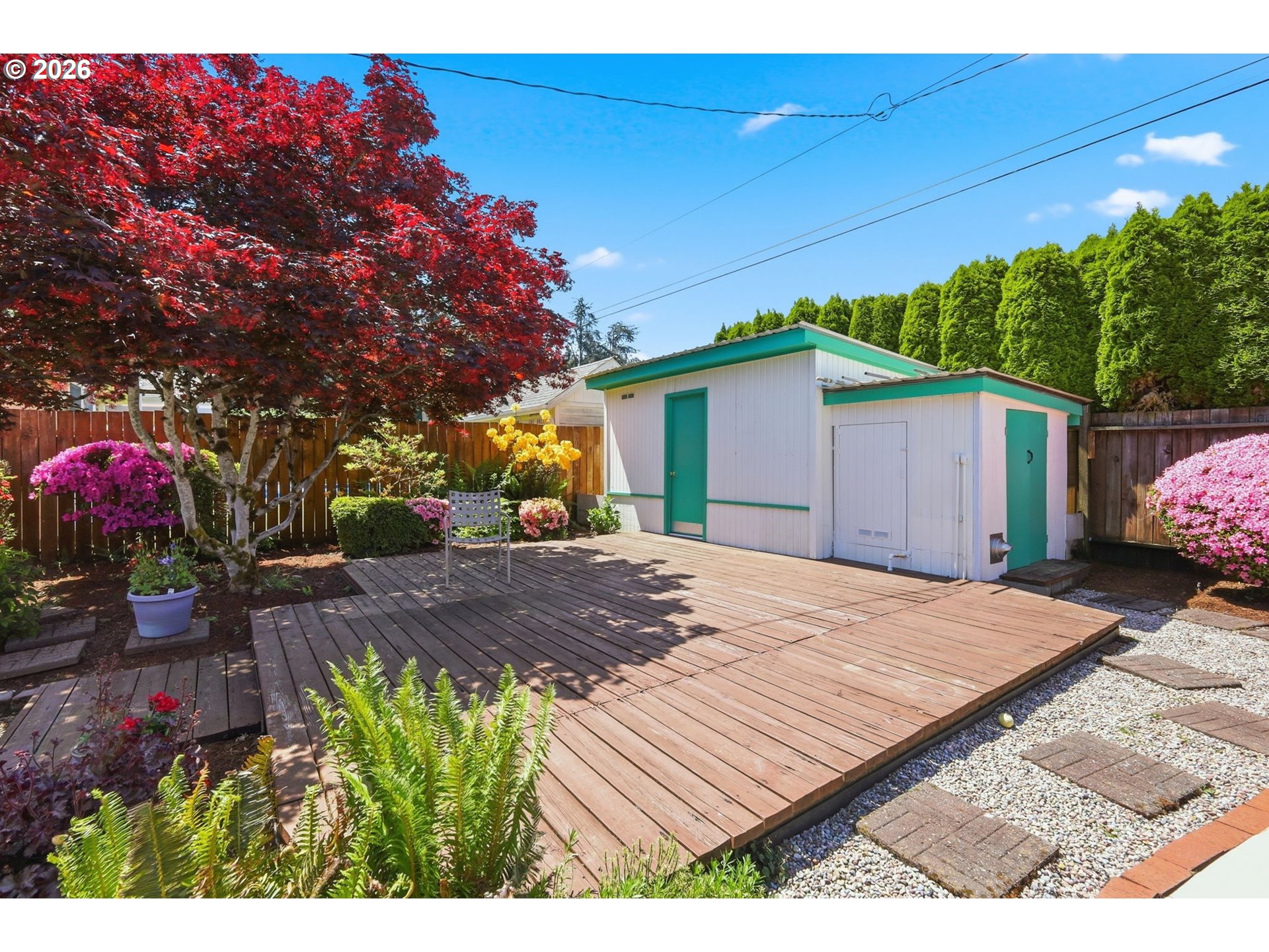 2494 38th Street Springfield, OR 97477 - Photo 32 of 38 a view of backyard with seating space and trees